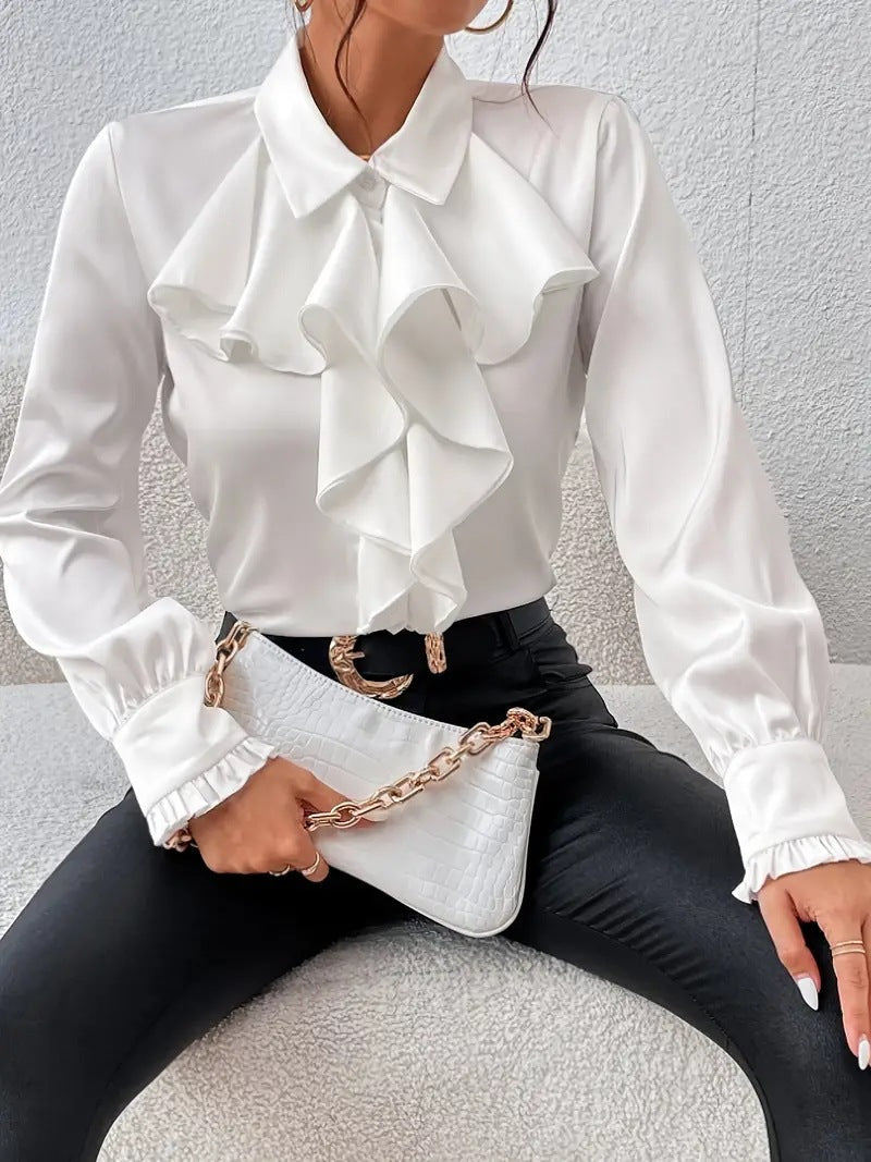 Stylish shirt with ruffled and layered design details.